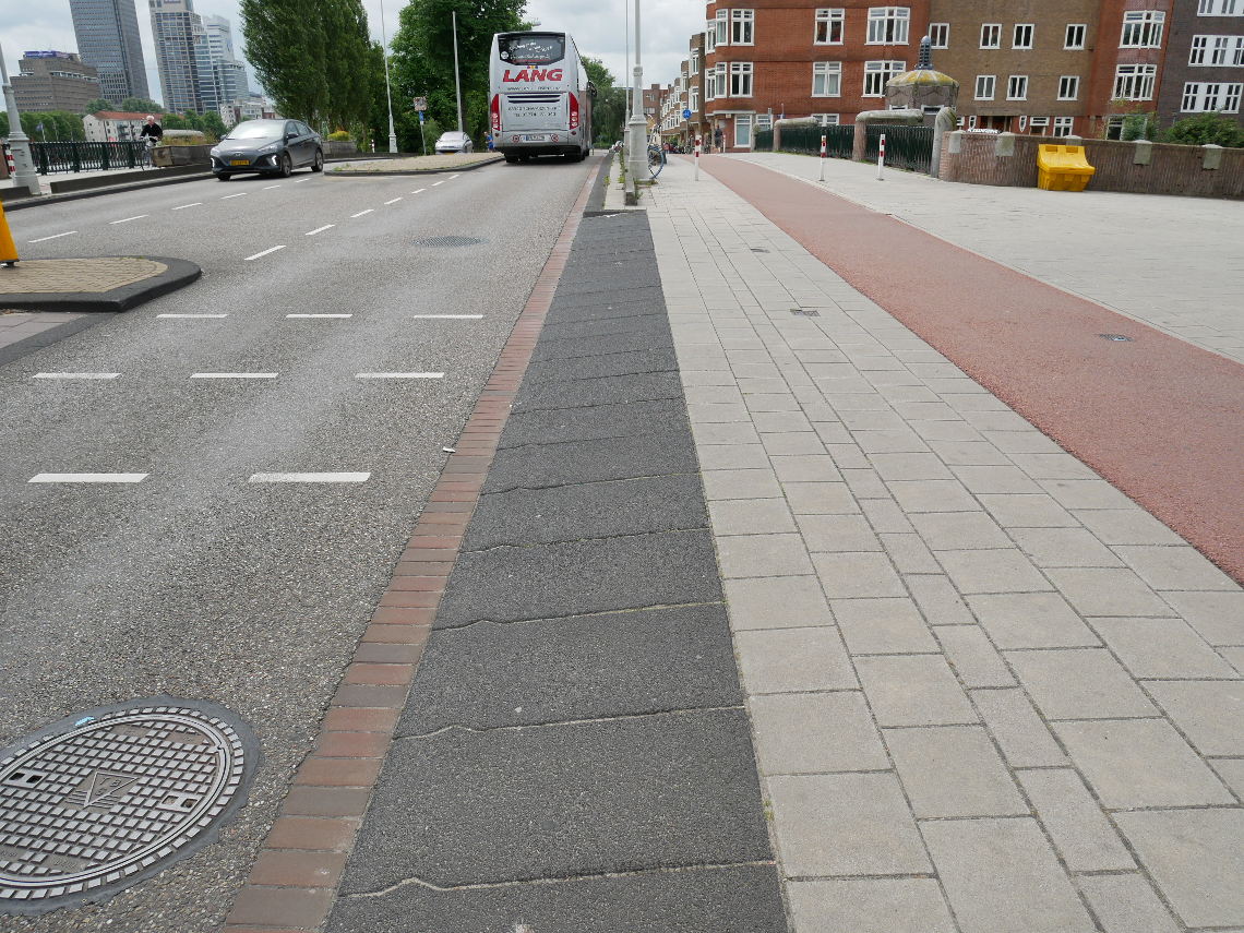 Image shows a close up of the inritbanden ramps used by vehicles to mount the footway.